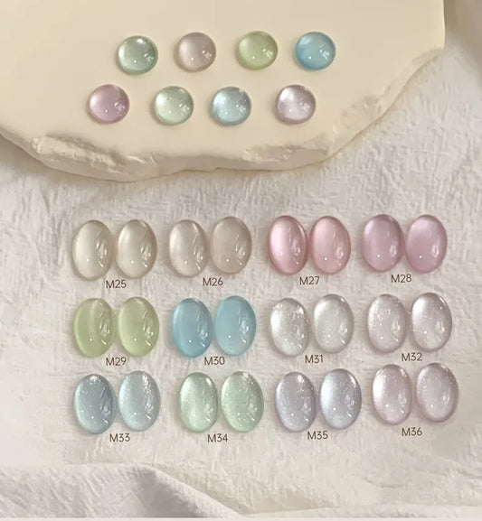 Karries Ice Jelly Cat Eye gel swatches M25-M36 on a stone tray