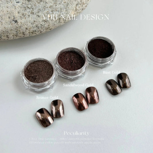 Mirror chrome nails in YHH Vintage Chrome Powder, three warm metallic shades