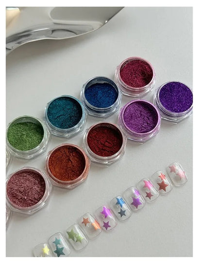 Jars of colored chrome powder with chrome star accent tips