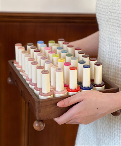 Moding Ebony & Cat color gel bottles in a wood display tray
