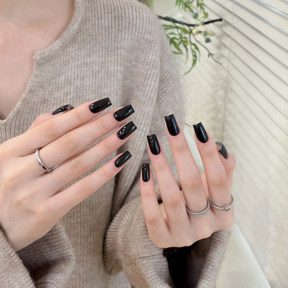 Little Black Bottle solid color gel shade 02 Extreme Black on nails