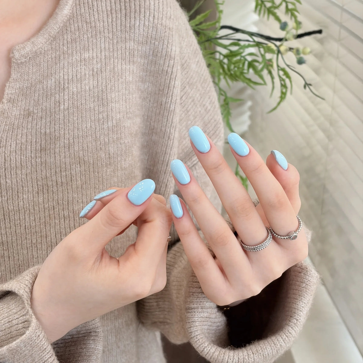 Little Black Bottle solid color gel shade 130 Milky Blue on nails
