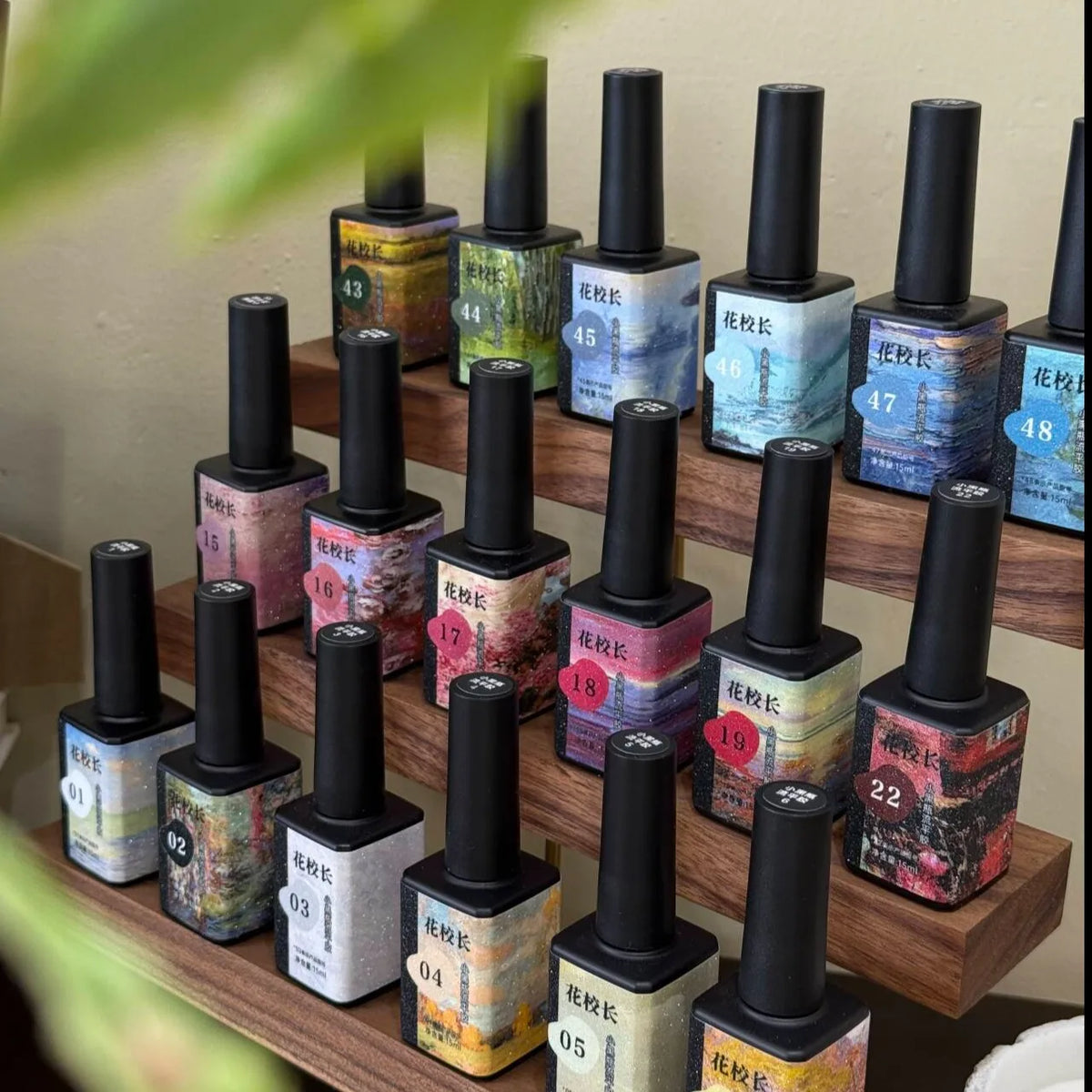 Flower Principal Little Black Bottle gel bottles on a tiered walnut rack
