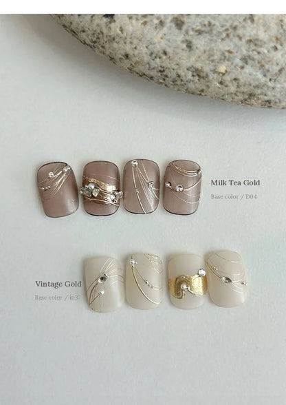 Milk Tea Gold and Vintage Gold nail art over neutral bases