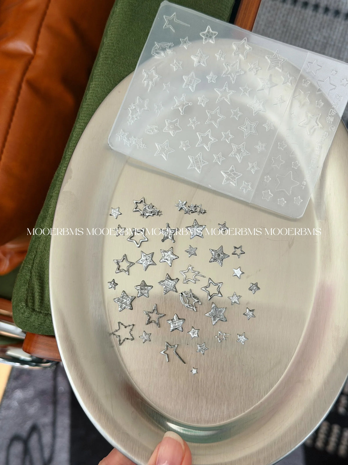 Holding the Star Family mold over a tray of chrome stars