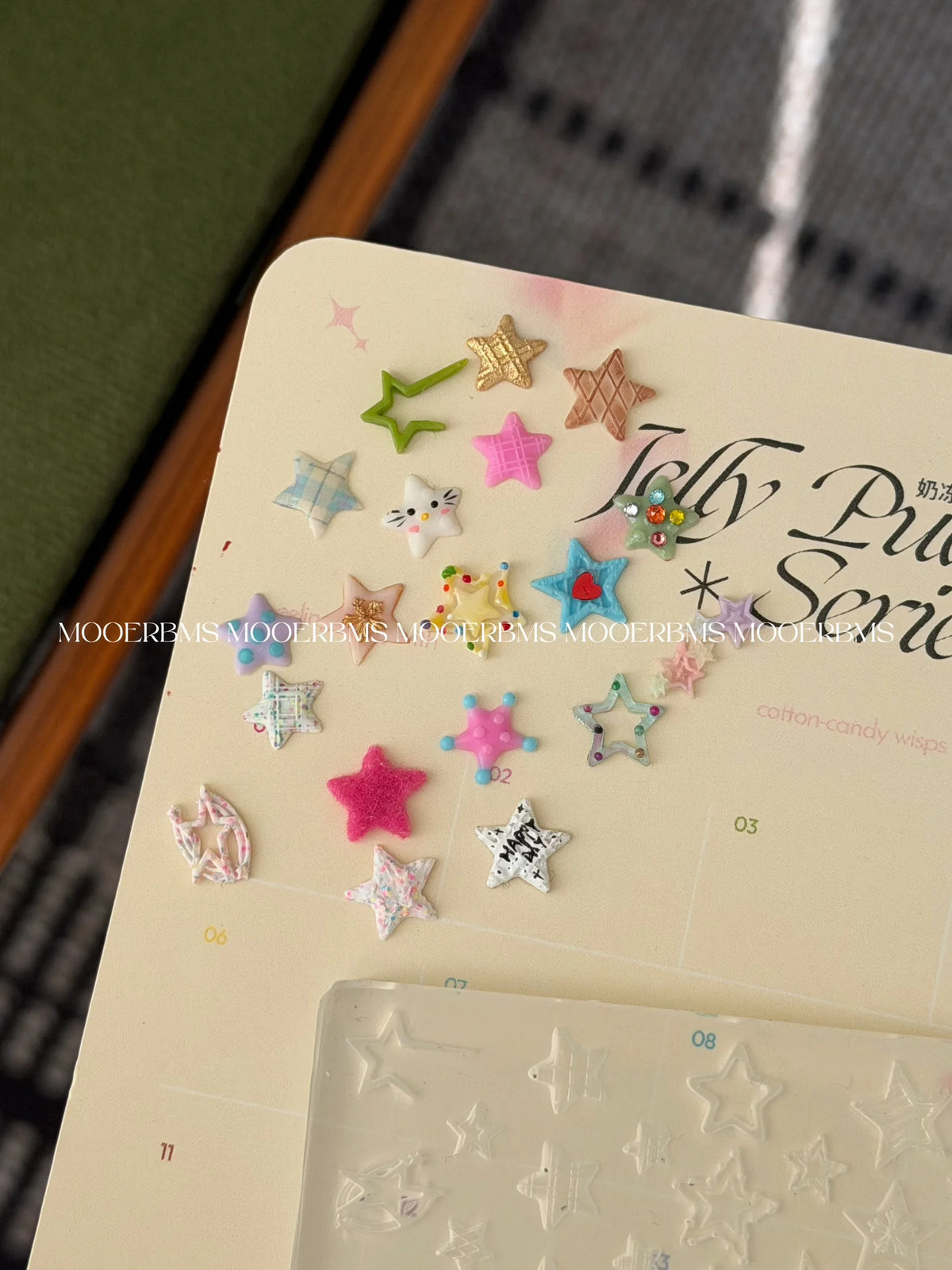 Jelly gel star charms on a swatch card next to the mold