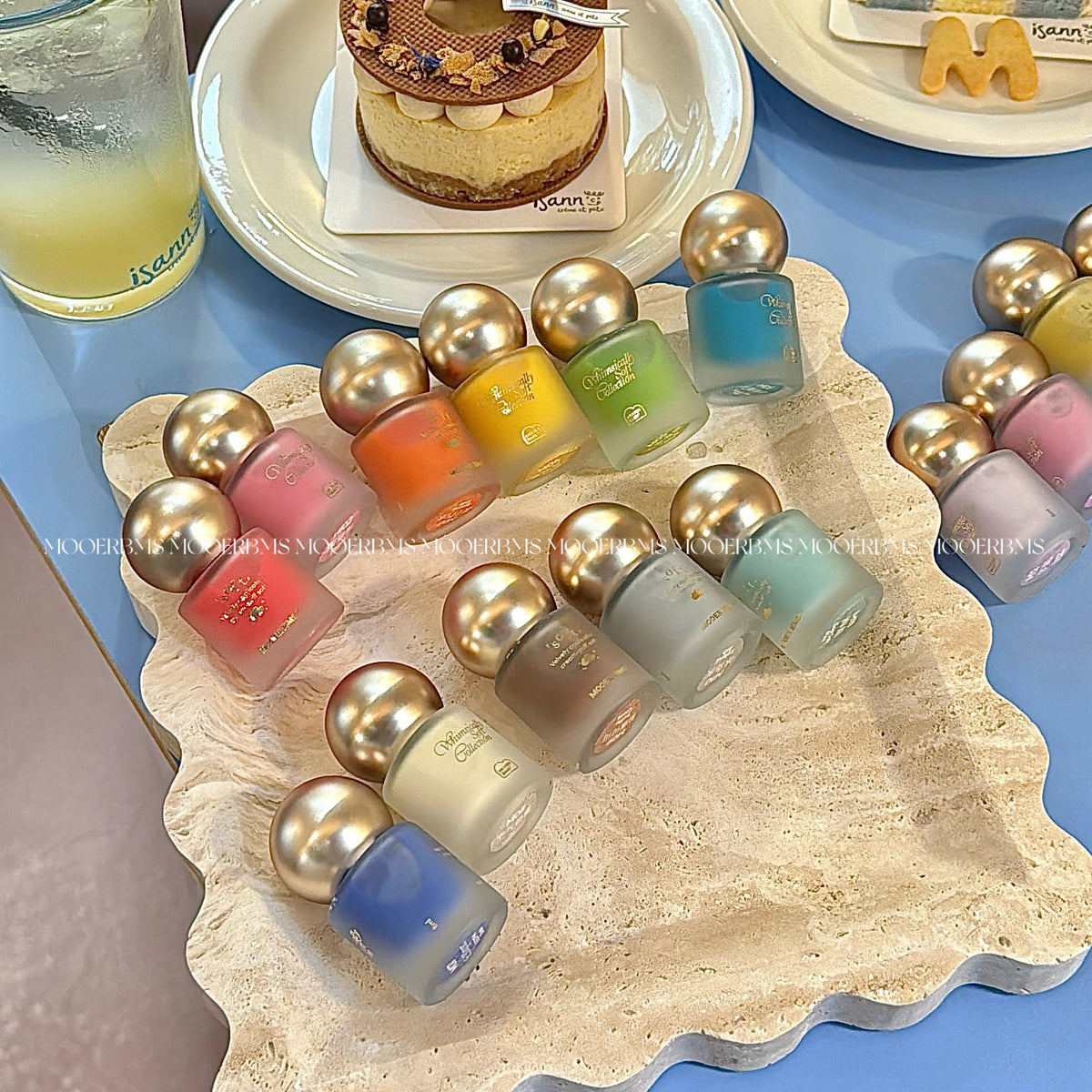 Whimsically Soft bottles on a scalloped stone tray