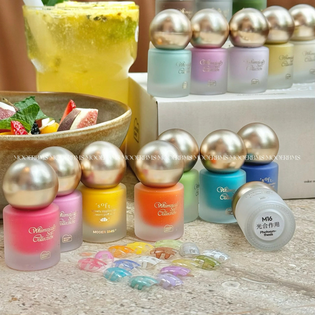Whimsically Soft bottles with swatch tips; M16 Photosynthesis label on the lid