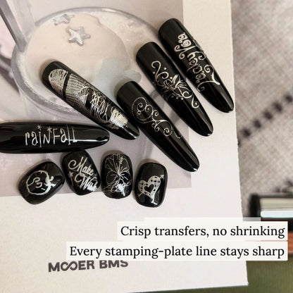 Crisp stamping-plate transfers in mirror silver on black nails