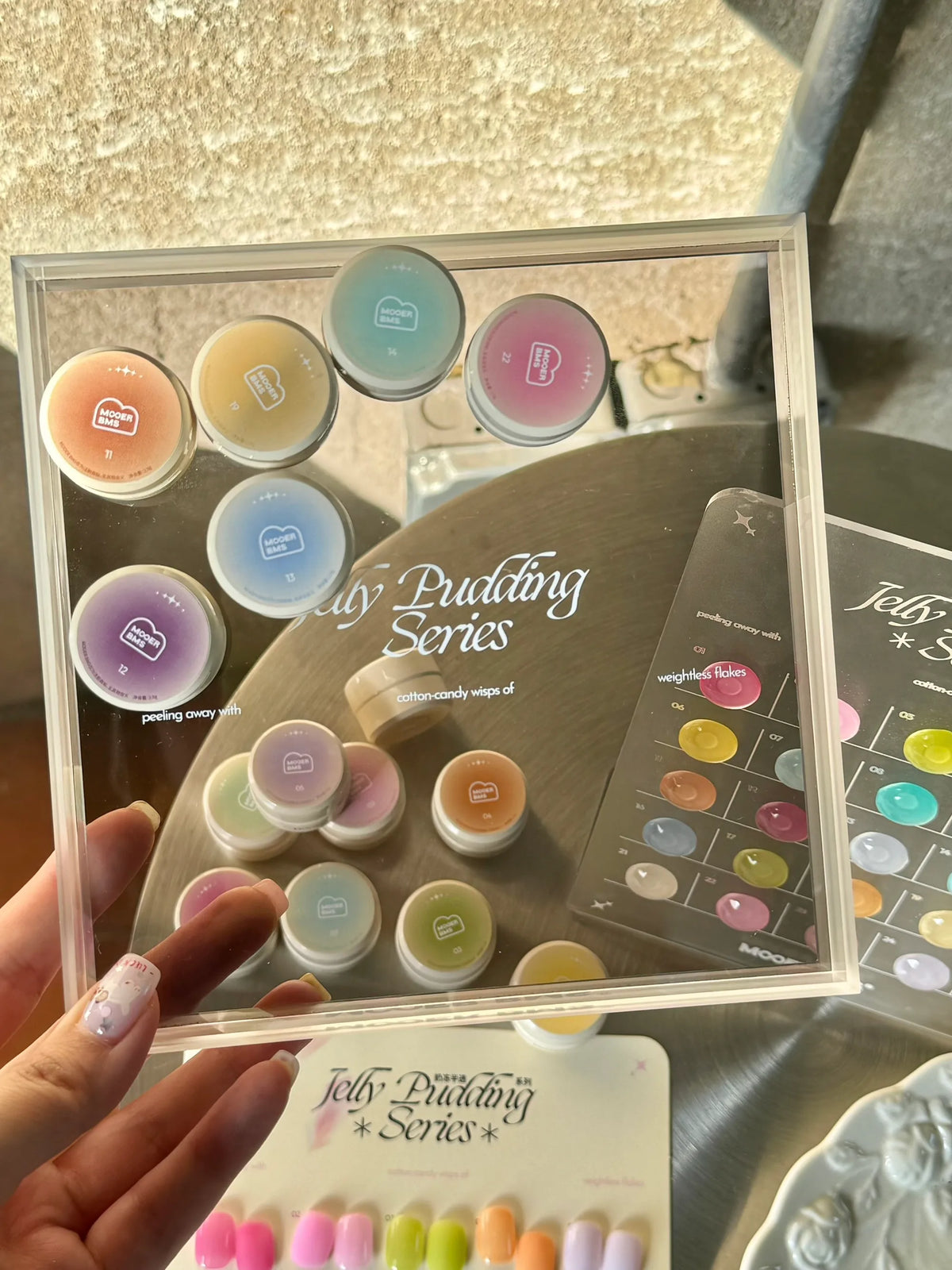 Milk Jelly jars and swatch card in hand