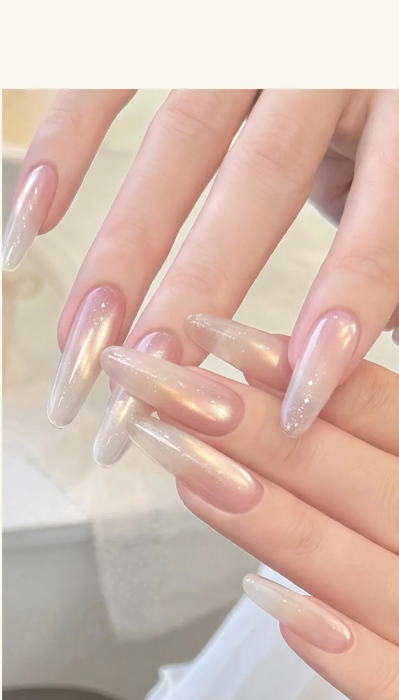 Sheer pearly cat eye on long almond nails