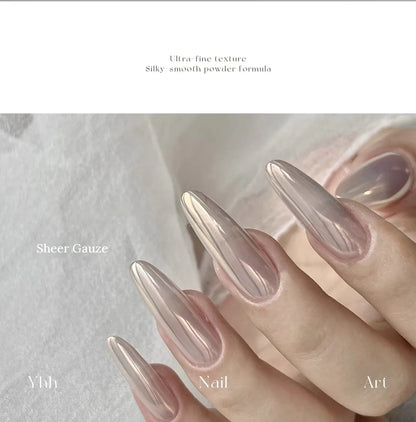 Sheer Gauze silk chrome powder worn on long almond nails over a sheer neutral base