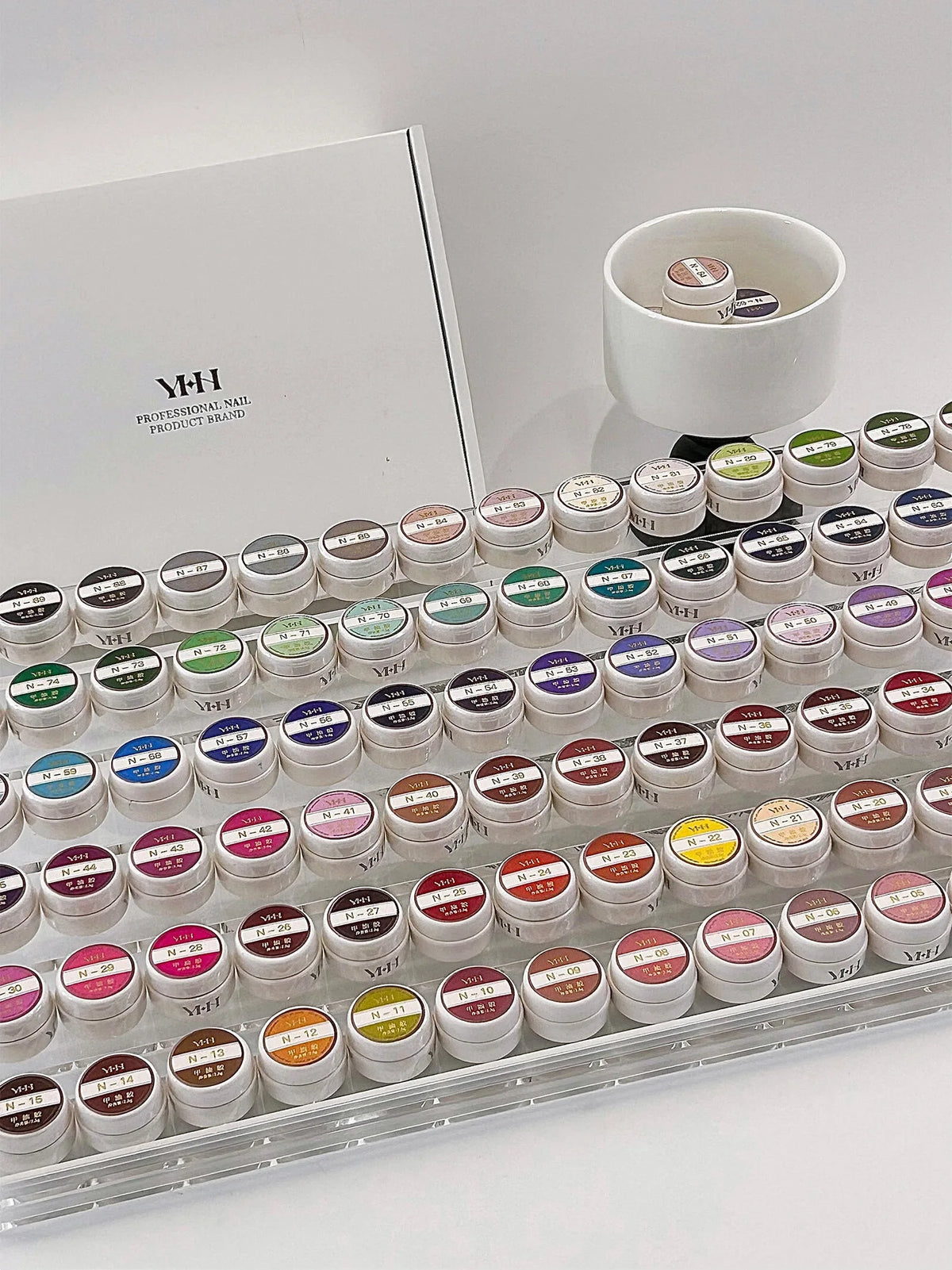 N Series jars lined up in an acrylic display rack