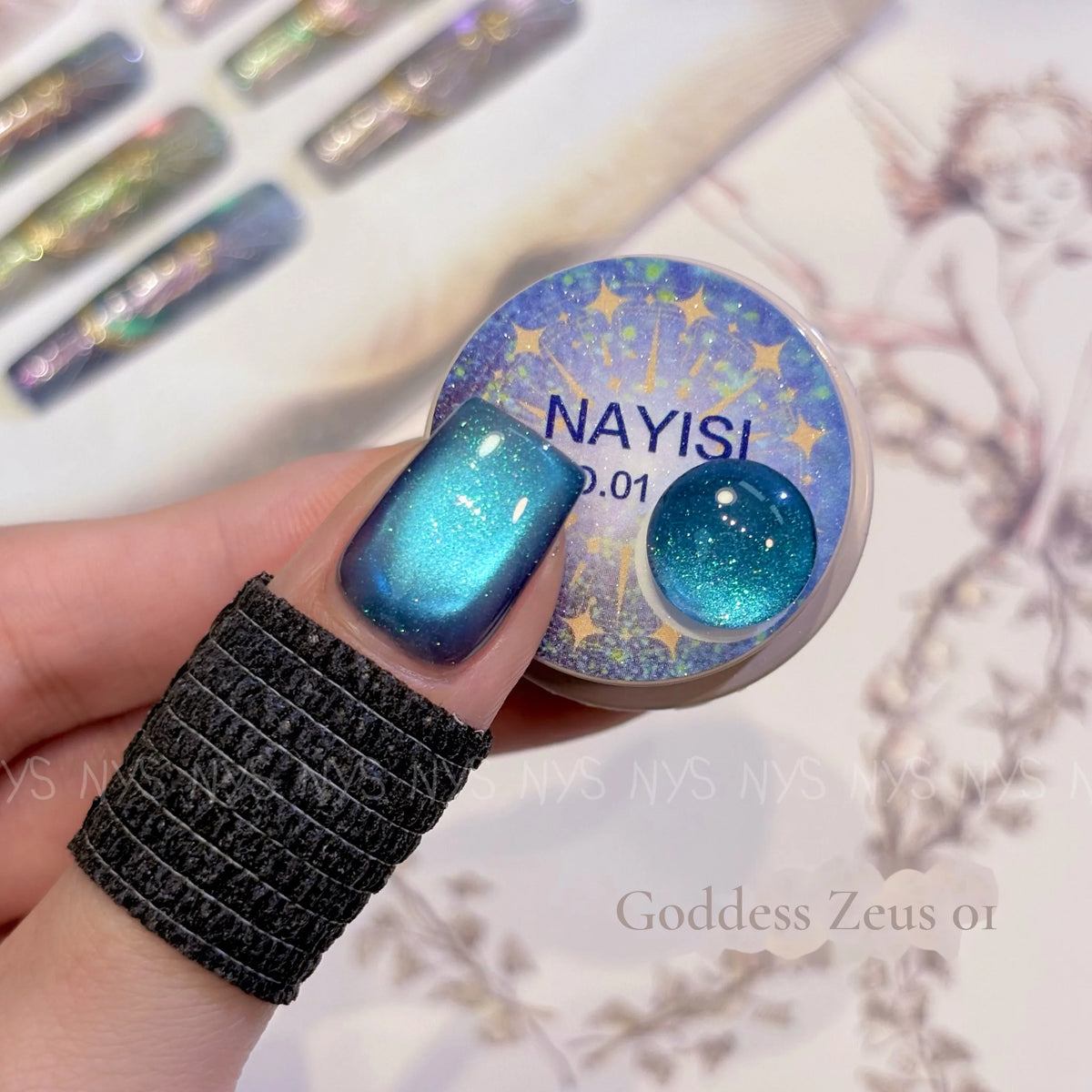 Goddess Zeus 01, ocean blue cat eye, on a nail beside its jar
