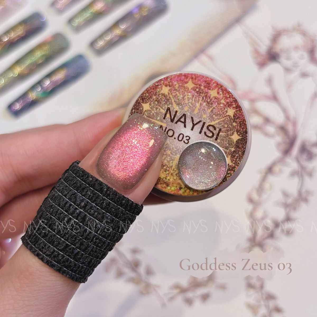 Goddess Zeus 03, coral pink cat eye, on a nail beside its jar
