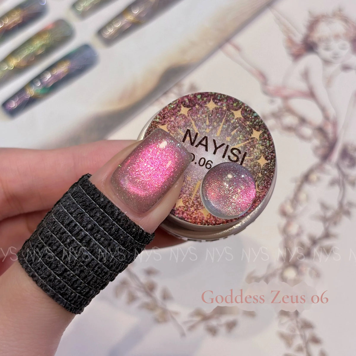 Goddess Zeus 06, hot pink cat eye, on a nail beside its jar