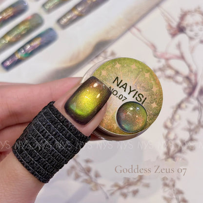 Goddess Zeus 07, gold-green cat eye, on a nail beside its jar
