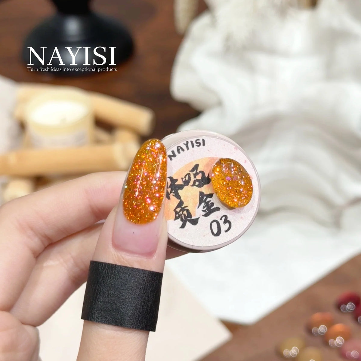 Riches and Treasures 3.0 03, honey amber glitter, on a nail beside its jar