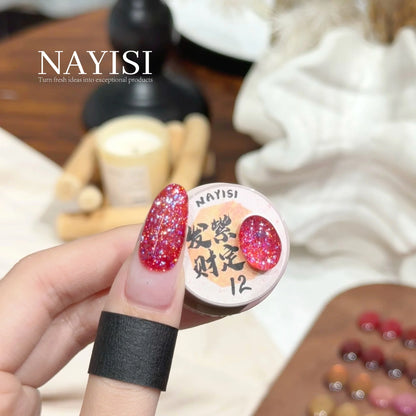 Riches and Treasures 3.0 12, magenta holo glitter, on a nail beside its jar