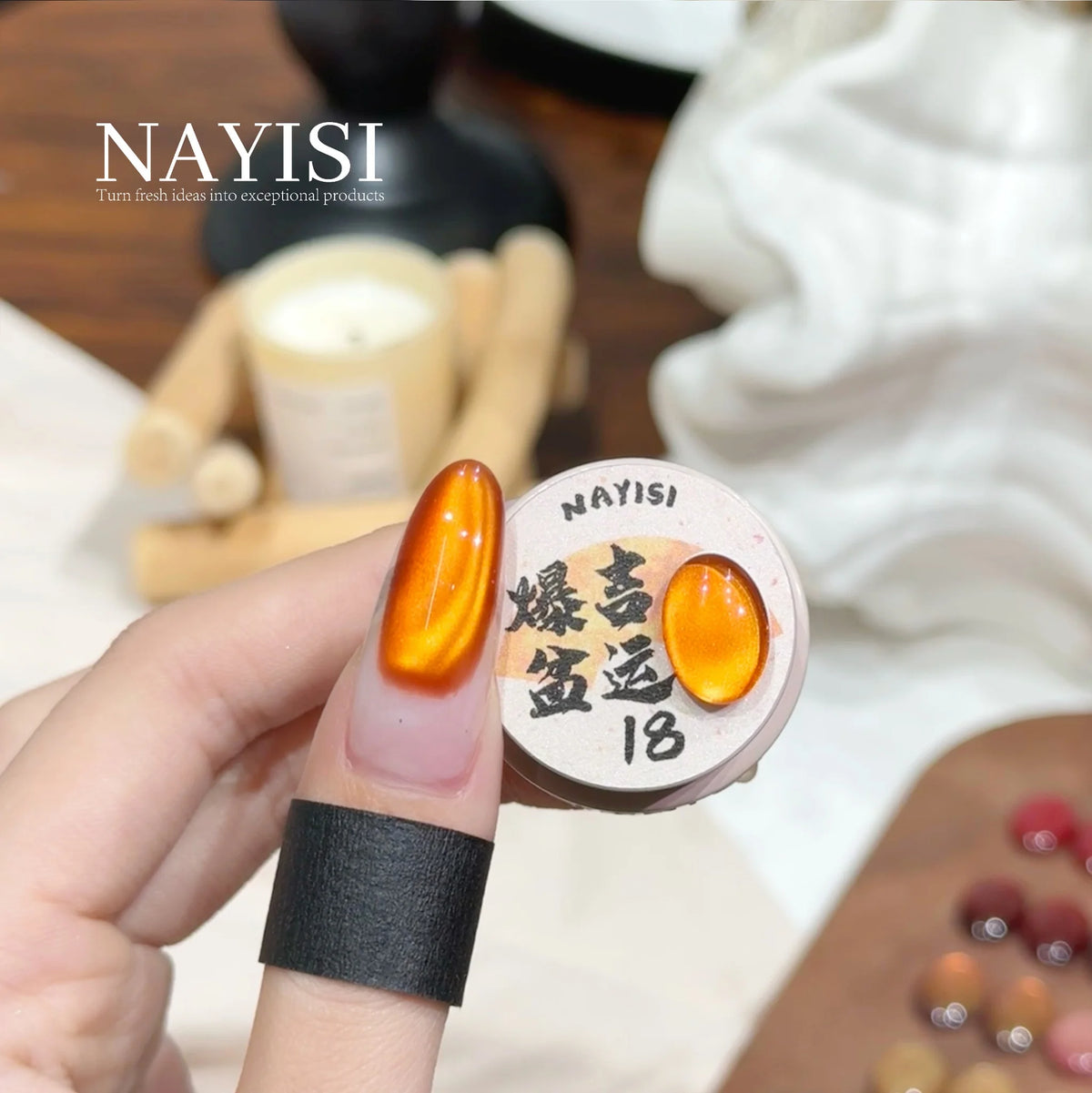 Riches and Treasures 3.0 18, tangerine cat eye, on a nail beside its jar
