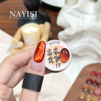Riches and Treasures 3.0 19, red-orange cat eye, on a nail beside its jar