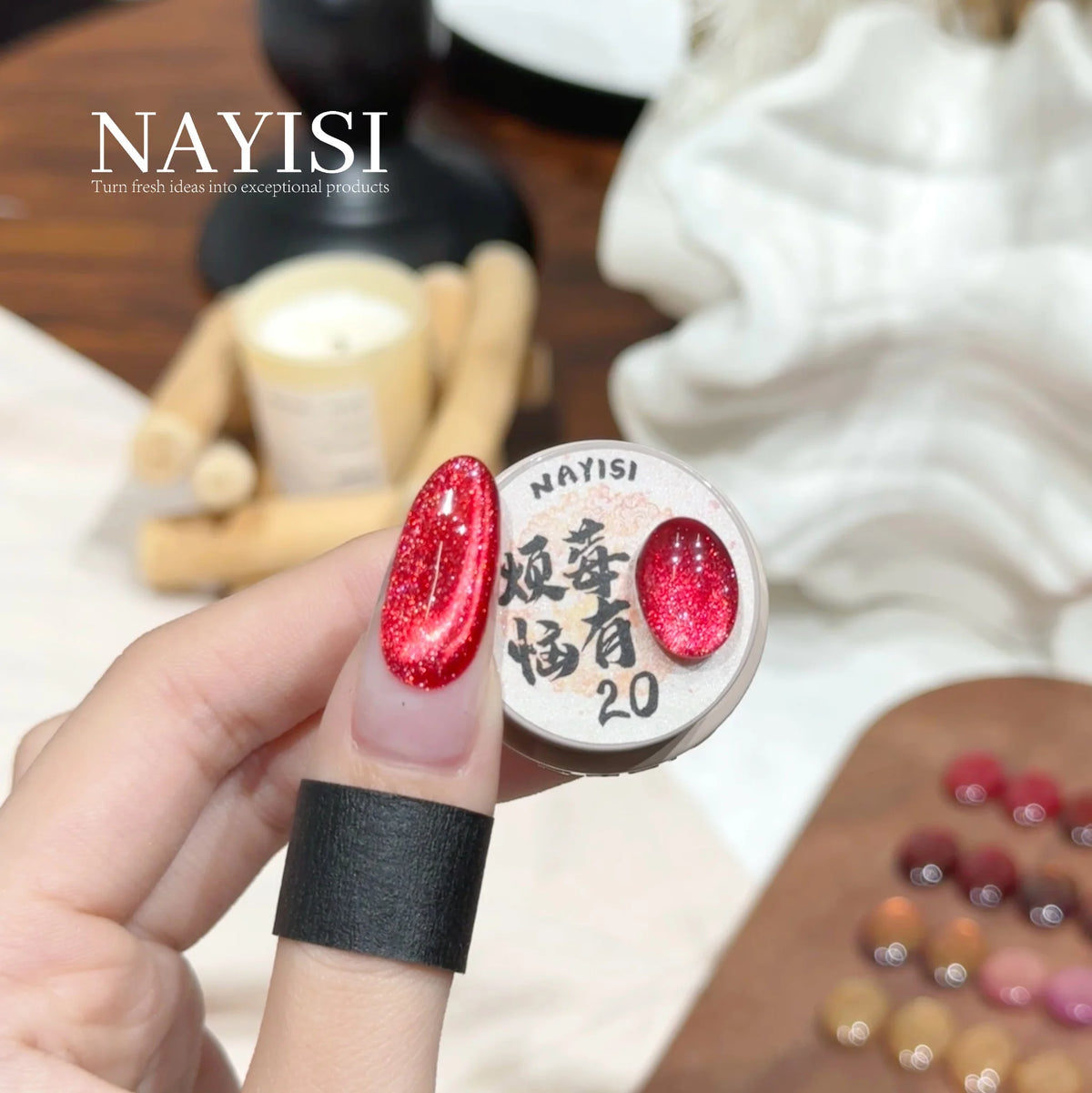 Riches and Treasures 3.0 20, strawberry red sparkle cat eye, on a nail beside its jar
