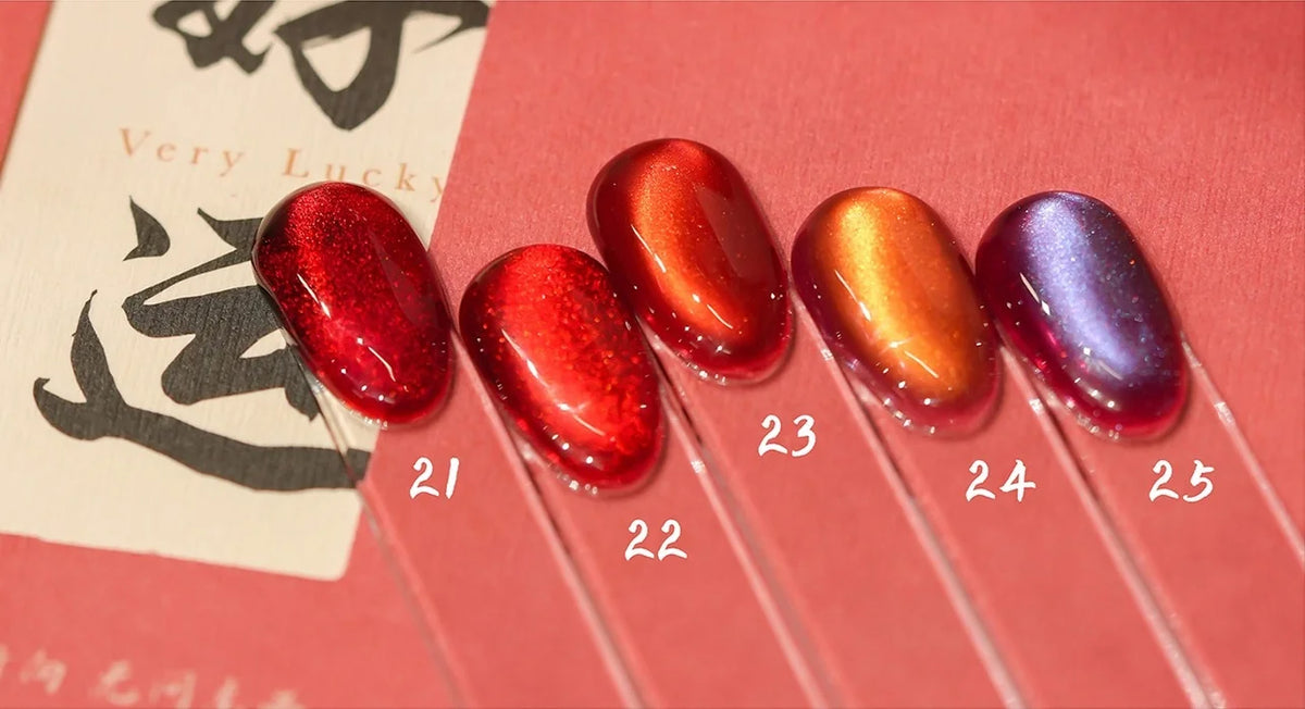 Cat eye shades 21-25 on nail tips: cherry, bright red, deep crimson, brick and plum