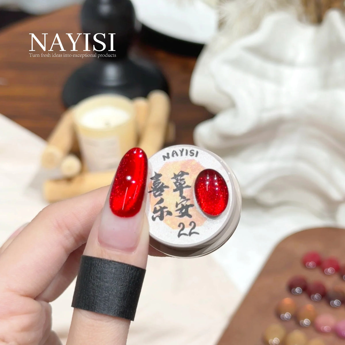 Riches and Treasures 3.0 22, bright red cat eye, on a nail beside its jar