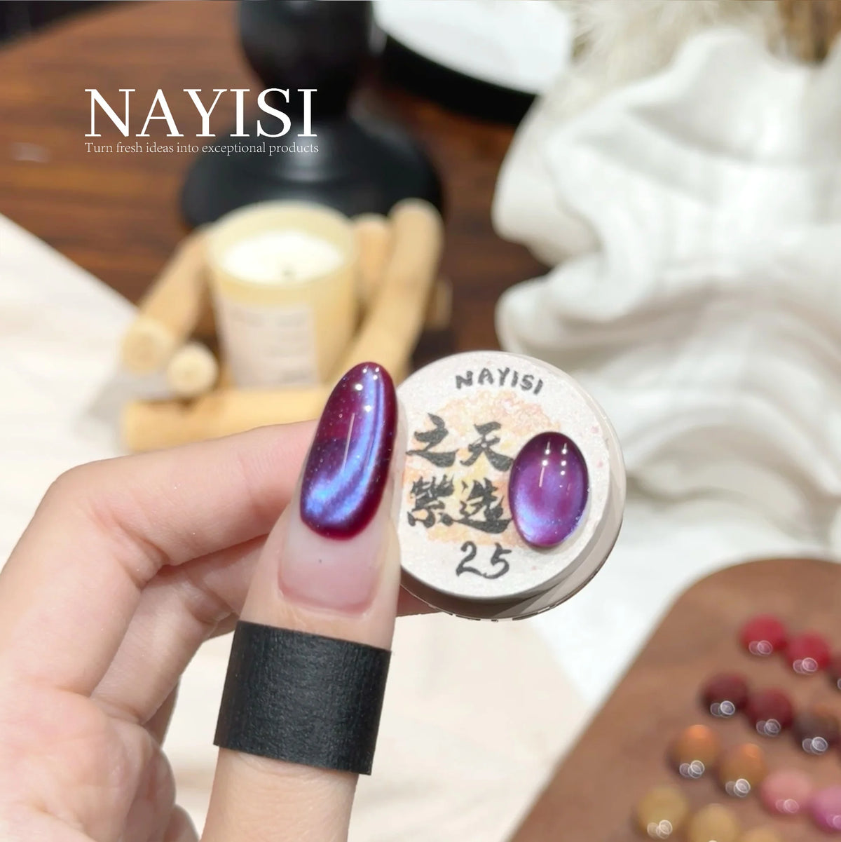 Riches and Treasures 3.0 25, plum cat eye with a blue-violet flash, on a nail beside its jar