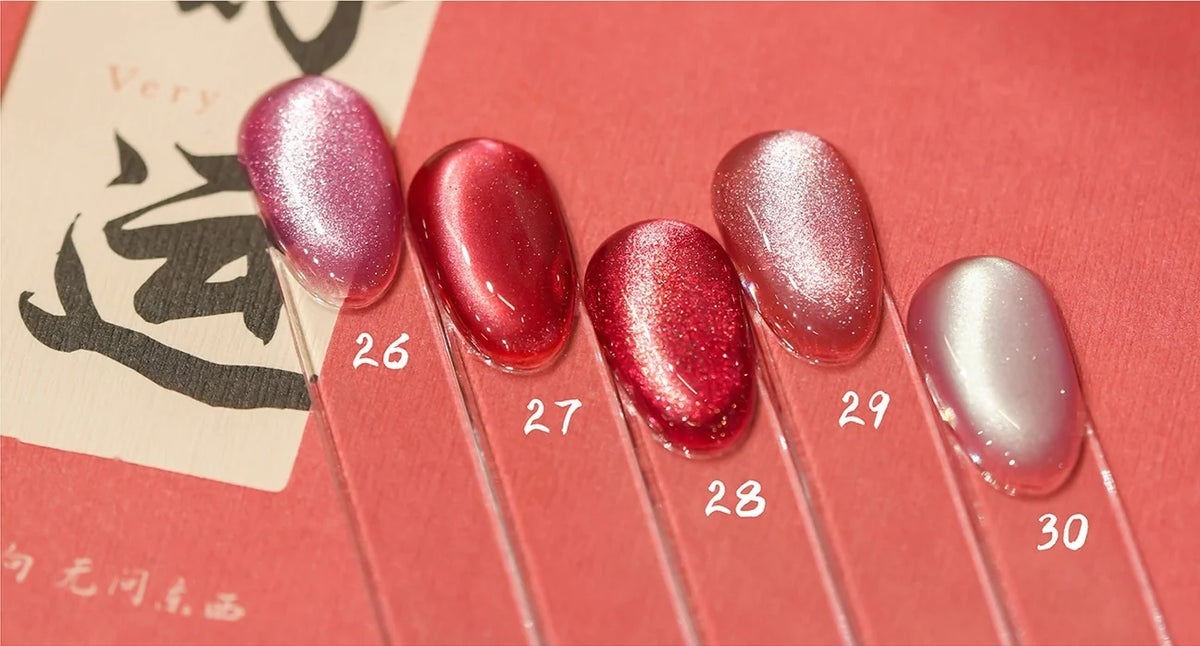 Cat eye shades 26-30 on nail tips: pink, raspberry, rose, coral pink and milky pearl
