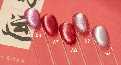 Cat eye shades 26-30 on nail tips: pink, raspberry, rose, coral pink and milky pearl