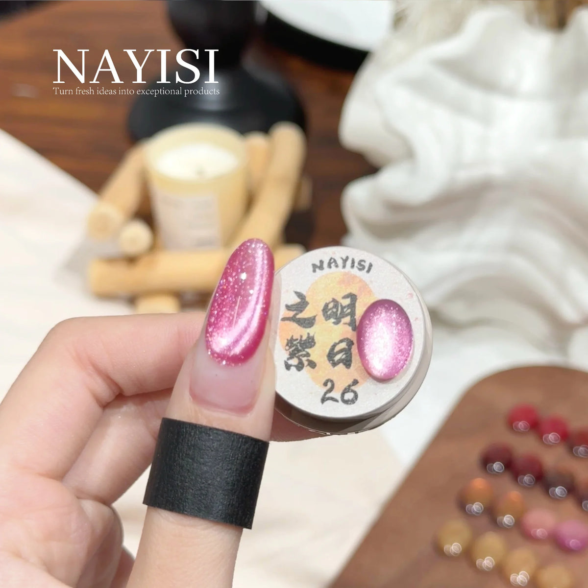 Riches and Treasures 3.0 26, pink sparkle cat eye, on a nail beside its jar