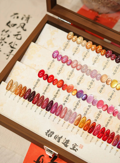Swatch board with all 30 labeled shades inside the wooden box