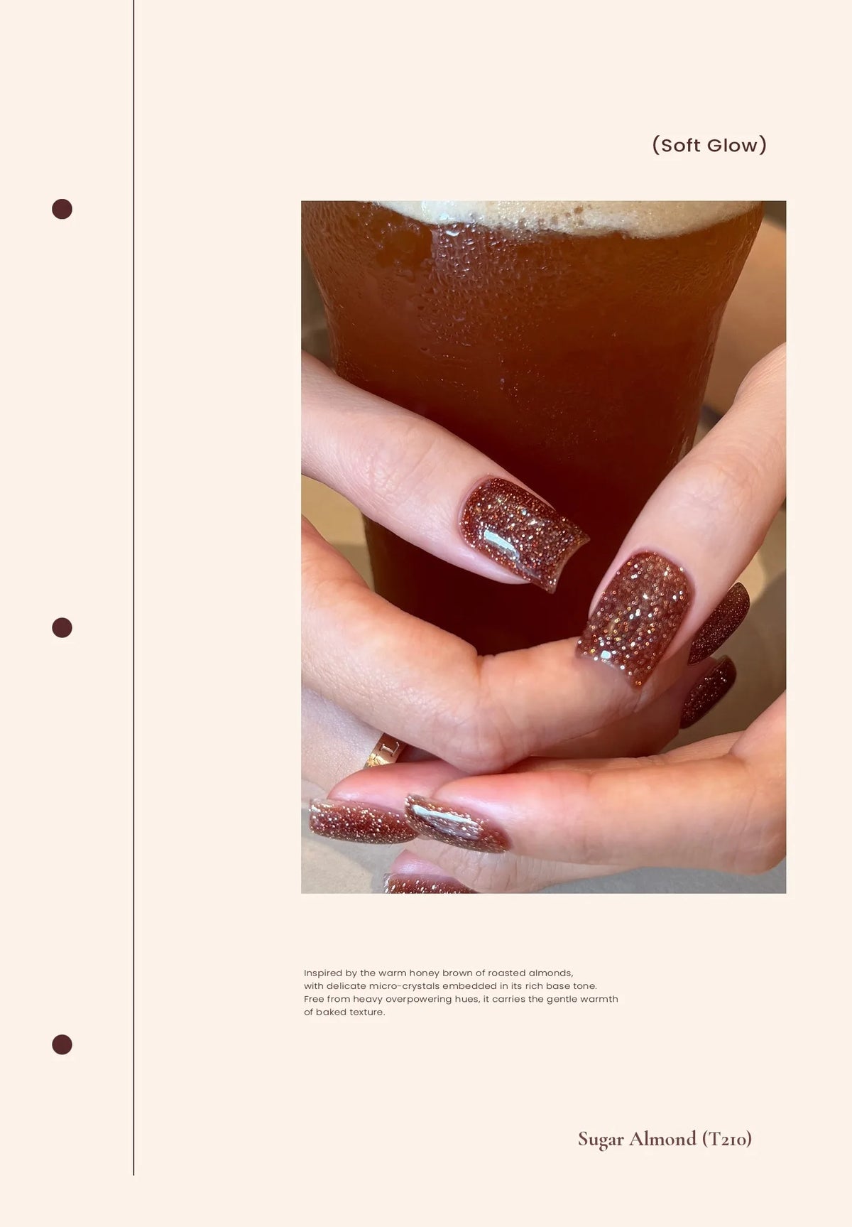 T210 Sugar Almond glitter nails holding iced coffee