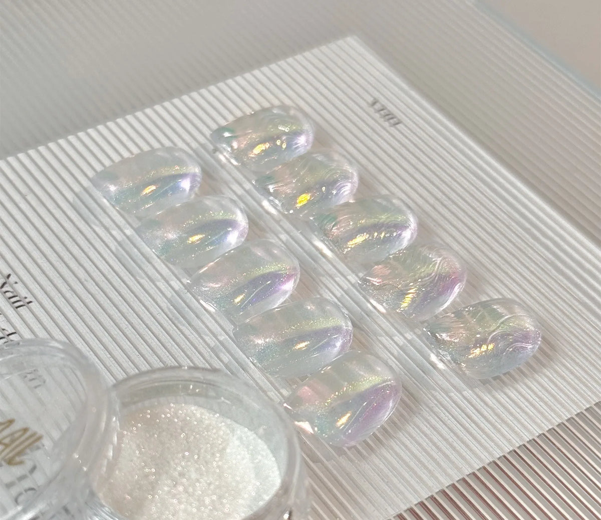 Rainbow chrome tips with an open jar of powder