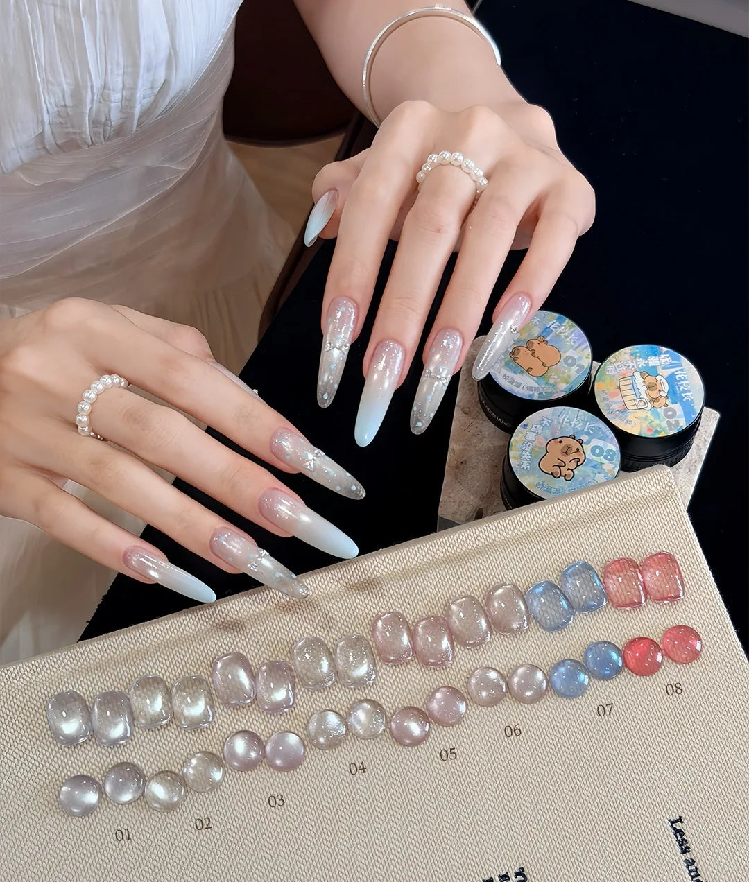 Flower Principal Sweet & Cute glass bead cat eye on long almond nails with swatch tips 01-08