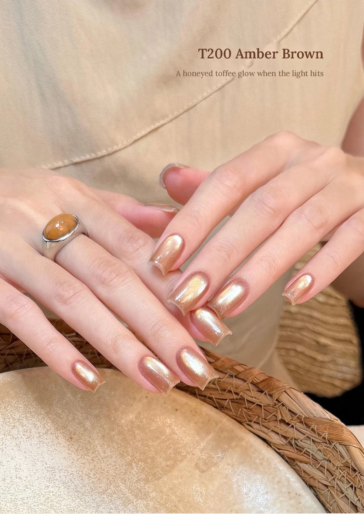 T200 Amber Brown cat eye manicure with a honeyed toffee glow