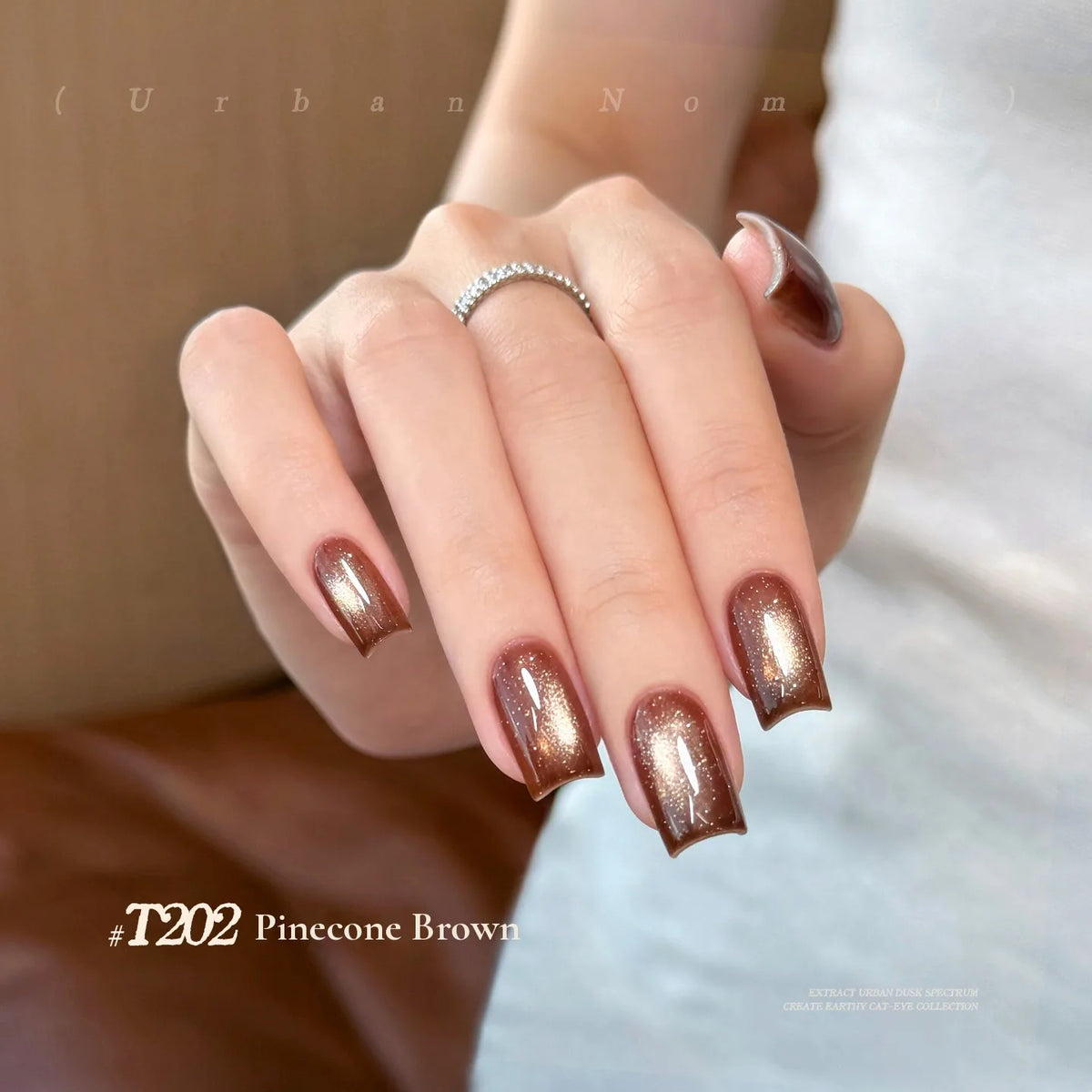TAYE Urban Nomad T202 Pinecone Brown cat eye gel polish on nails