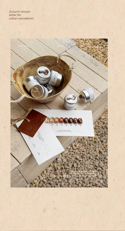Urban Nomad cat eye jars and swatch card on stone pavers