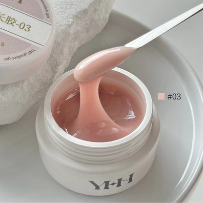 YHH Aqua Glow Extension Gel shade 03, 15 g jar with gel on a spatula