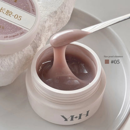 YHH Aqua Glow Extension Gel shade 05, 15 g jar with gel on a spatula