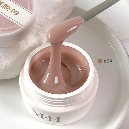 YHH Aqua Glow Extension Gel shade 09, 15 g jar with gel on a spatula