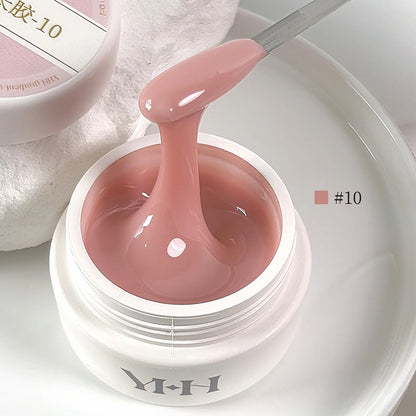YHH Aqua Glow Extension Gel shade 10, 15 g jar with gel on a spatula