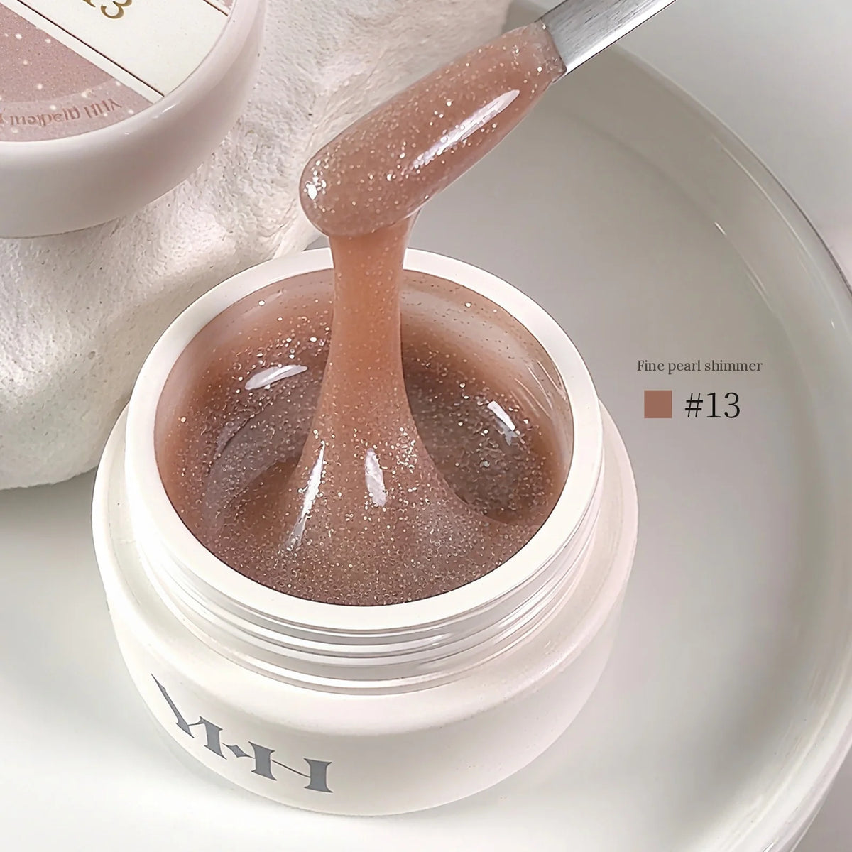 YHH Aqua Glow Extension Gel shade 13, 15 g jar with gel on a spatula