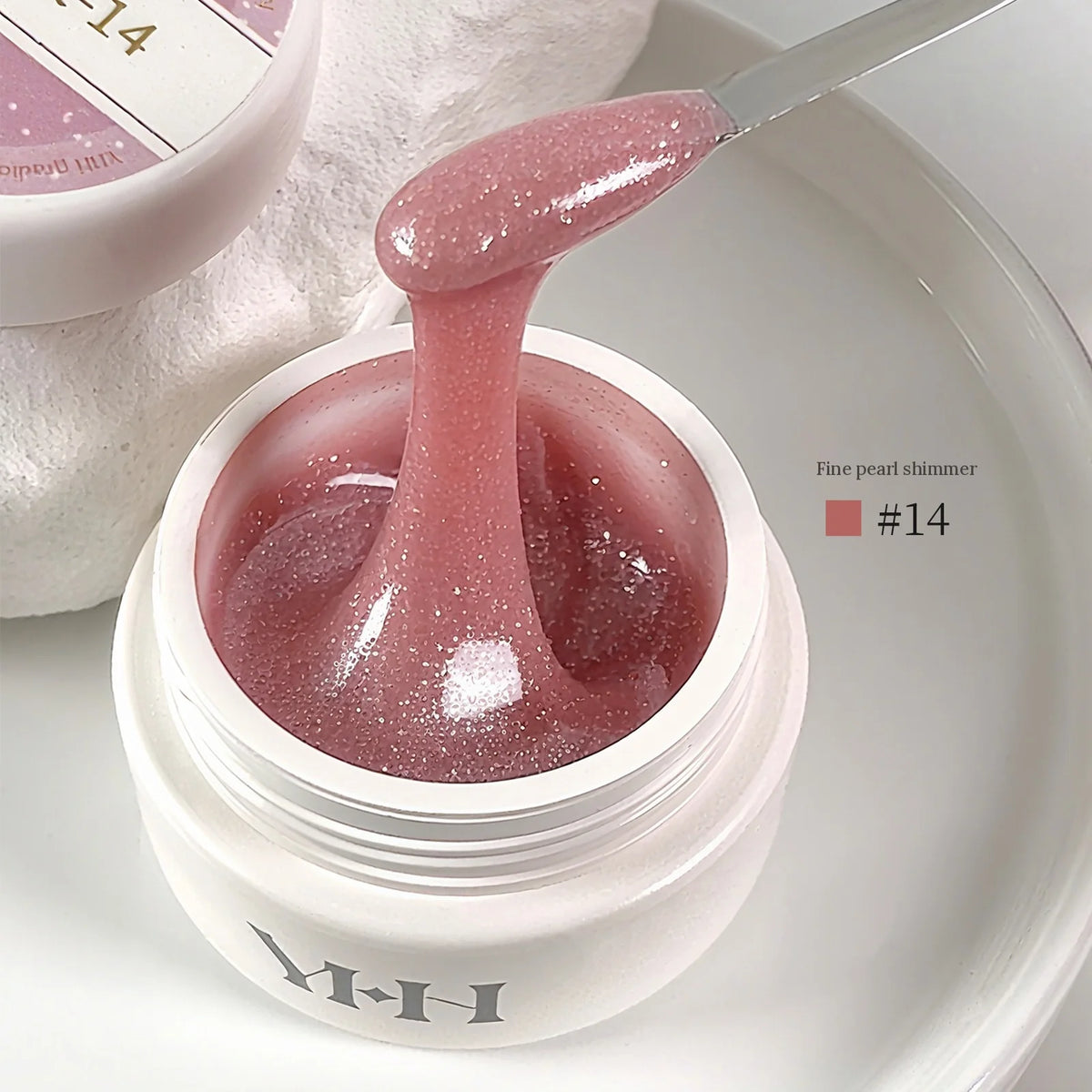 YHH Aqua Glow Extension Gel shade 14, 15 g jar with gel on a spatula