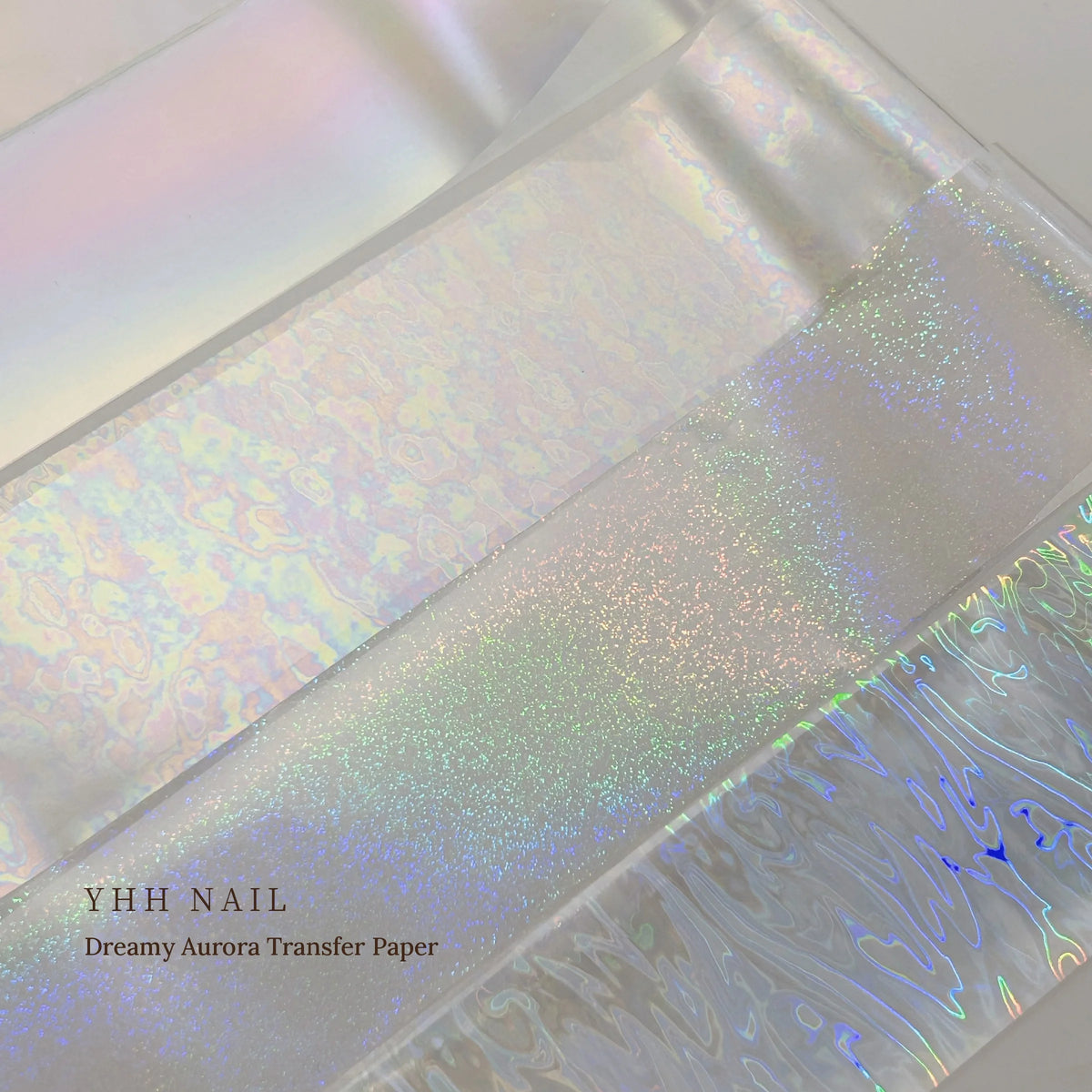 Close-up of YHH aurora transfer foil strips with holographic sparkle and shimmer patterns