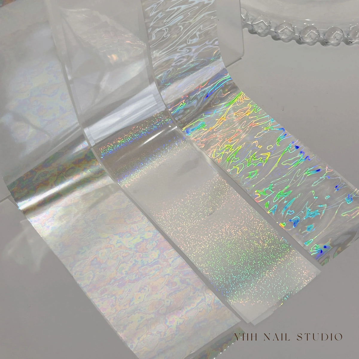 YHH aurora transfer foils showing holographic, glitter and crackle-pattern finishes