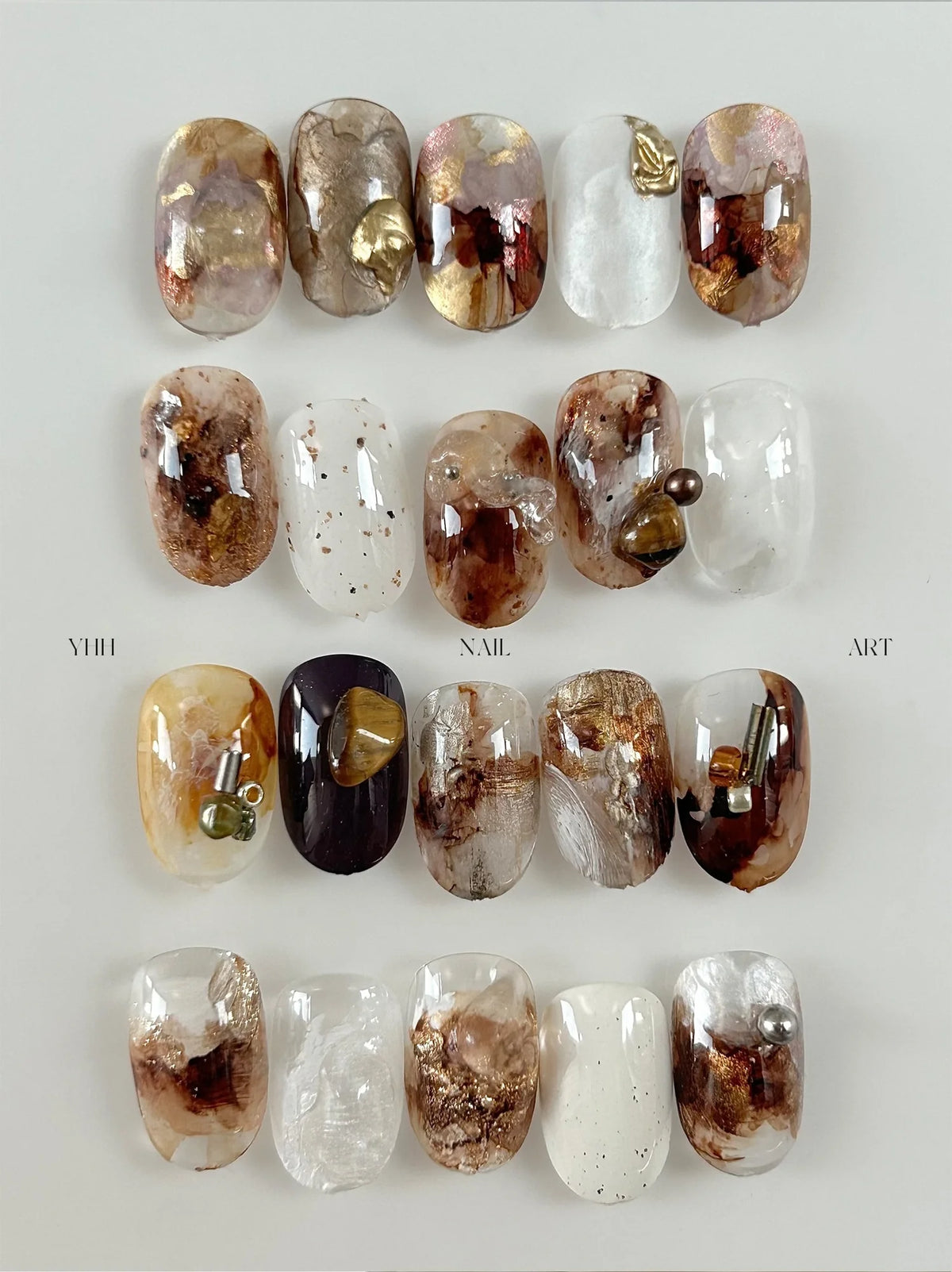 Nail art made with YHH blending ink: brown and amber watercolor marble designs