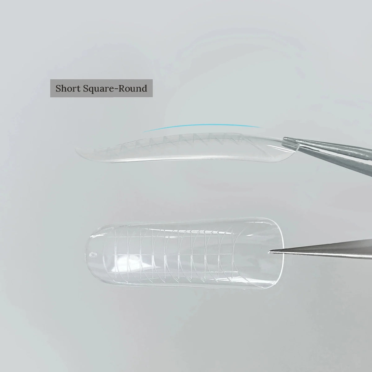 YHH clear dual nail forms, Short Square-Round shape, held with tweezers