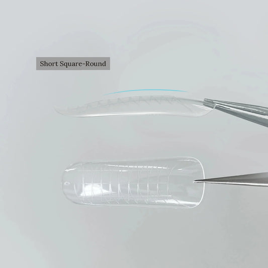 YHH clear dual nail forms, Short Square-Round shape, held with tweezers